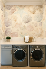 Seashell pattern wallpaper with starfish by unknown brand, covering the laundry room walls in a coastal style.