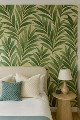 Green leaf patterned wallpaper with green leaf design, styled on a bedroom wall.
