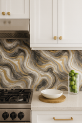 Obsidian Reverie wallpaper featuring swirling gray, black, and gold marble-like patterns.