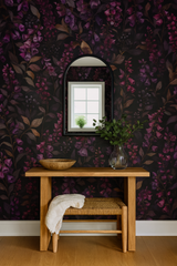 Floral wallpaper with a dark background and purple flowers, featuring a leafy pattern.