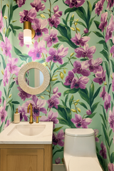 Velvet Tropica wallpaper with purple orchid pattern on a teal background.
