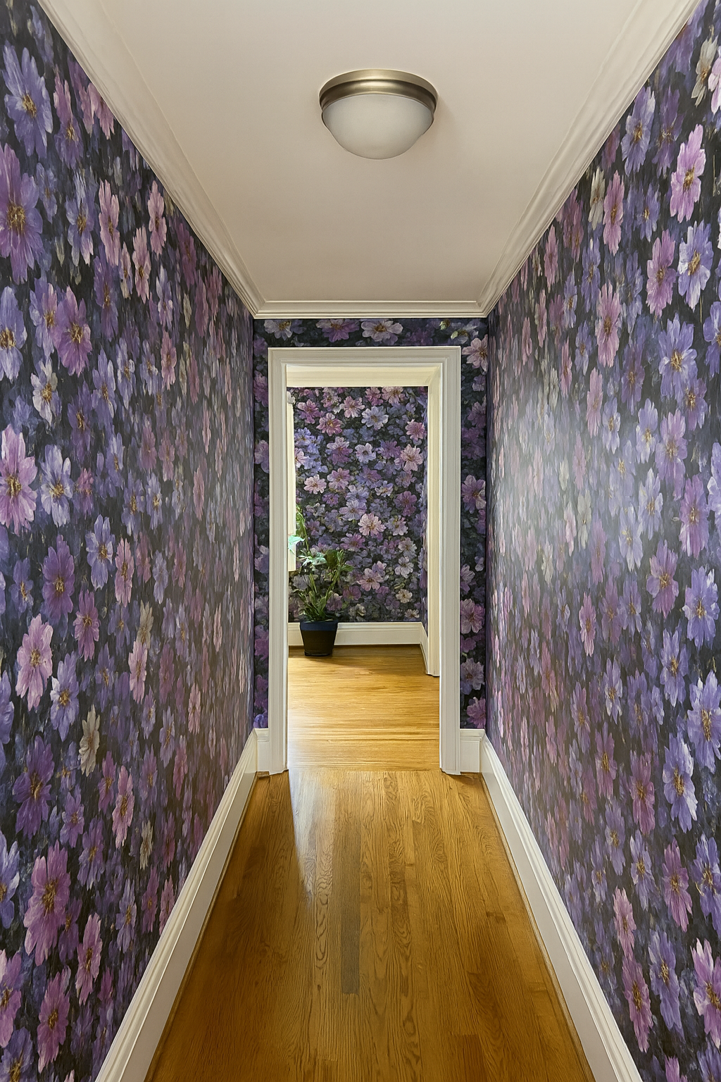 Moonlit Meadow Wallpaper with purple and black floral pattern.