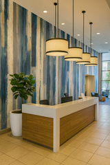 Gouache Drift Wallpaper with blue, white, and gray stripes, lending an abstract, modern texture to the wall.