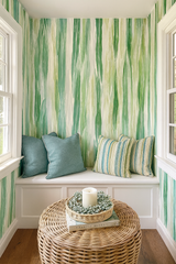 Whispering Blades wallpaper with a green and white abstract pattern on the wall.
