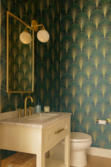 Emerald Deco Bloom wallpaper with gold fan pattern on green background.
