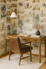 Canyon Sketch Wallpaper featuring a tiled desert scene, with cacti, rock formations, and cowboys on horseback.
