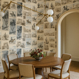 Canyon Sketch wallpaper featuring a repeating desert motif and framed by an arched doorway.
