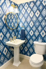 Indigo Mirage Wallpaper with a blue diamond pattern covering the walls.
