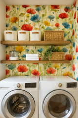 Floral meadow wallpaper with red, yellow, and blue watercolor flowers against a light beige backdrop.
