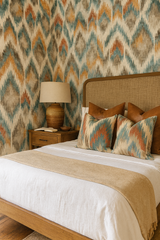 Zigzag Zuni wallpaper with a native inspired pattern, including hues of blue, brown, and gold.