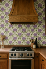 Floral print wallpaper with purple blooms against a patterned backdrop.