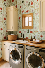 Botanical wallpaper with floral pattern in red, pink, and green on a light blue background.