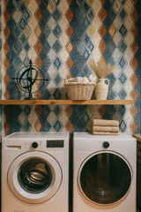 Diamond patterned wallpaper with blue, tan, and brown colors, featuring a diamond and geometric style design.