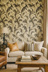 Floral flourish wallpaper in black and gold with swirling feather pattern.
