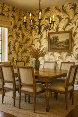 Featherstorm Flourish wallpaper with feather-like pattern, accenting a traditionally styled dining room, complete with a wooden table and upholstered chairs.