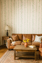 Floral striped "Sweet Pea Parade" wallpaper with green vines and pink flowers.
