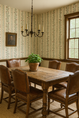 Sweet Pea Parade wallpaper, with a floral pattern, features green vines and pink flowers on a beige backdrop.