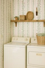 Floral striped wallpaper with green and pink accents, in a vintage style.
