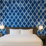 Diamond drift wallpaper with shibori-inspired pattern, a design of blue and white geometric shapes.