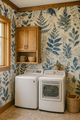 Botanical wallpaper with blue leaf print on beige background.