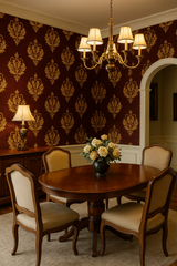 Laurel Court wallpaper with a damask pattern, covering the dining room wall behind a table and chandelier.