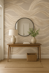 Dune currents wallpaper with wave pattern on a wall, with a round mirror and a table.