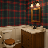Tartan patterned wallpaper with red and green hues, from Brewster Home Fashions, covering the upper half of a bathroom wall.