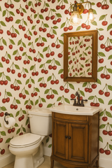 Cherry Bombshell wallpaper with a red cherry pattern on a white background.