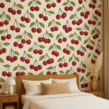 Cherry Bombshell Wallpaper featuring a playful cherry pattern, styled in a bedroom setting with natural light.
