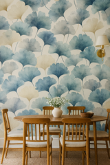 Botanical leaf wallpaper with blue and beige ginkgo pattern, covering a dining room wall.