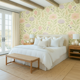 Pomegranate Parade Wallpaper with a floral pattern on a light yellow background.
