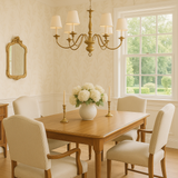 Floral wallpaper with leaf pattern, covering the walls in a dining room setting.