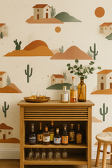 Cactus Ghost Ranch wallpaper with desert landscape and house pattern on beige background.