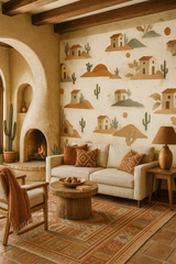 Desert-inspired wallpaper with houses and cacti by Ghost Ranch, displayed in a living room setting with Southwest style decor.
