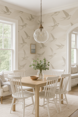 Beige bird-patterned wallpaper from Anthropologie, visible in a dining room setting with traditional furnishings.
