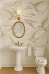 Wind Lines wallpaper with bird pattern, from York Wallcoverings, in a powder room setting.