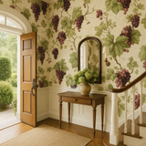 Vineyard Reverie Wallpaper with grape vine pattern and green leaves on a beige background.

