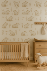 Neutral capybara print wallpaper with illustrations of capybaras and reeds.