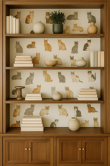 Cat's Meow Wallpaper with cat patterns and neutral background, on a wooden bookshelf.