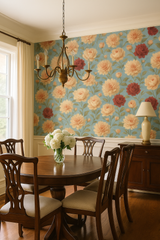 Floral wallpaper featuring dahlias with a vintage-inspired design, patterned with blooms in soft peach and deep red on a light blue background.