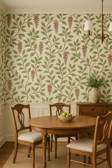 Botanical-themed wallpaper with green leaves and mauve flower pattern on beige, in the style of traditional design.

