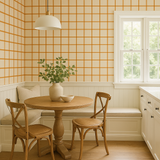 Sunstone Grids Wallpaper with orange grid pattern on cream background.