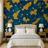 Gilded archipelago wallpaper with teal and navy accents, set in a bedroom with neutral decor.
