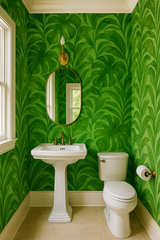Green verdant dreams wallpaper with leaf pattern, no brand provided, in a bright bathroom setting.
