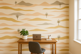 Dune Lines Wallpaper with desert-inspired pattern, featuring waves of tans, golds, and grays, creating a calming landscape.