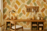 Painter’s Palette Wallpaper, featuring brushstroke pattern in earth tones on a light beige background.
