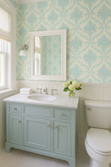 Vintage damask wallpaper with a blue leaf pattern on an off-white background.