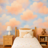 Cloudscape wallpaper featuring orange-peach clouds on a blue sky background.
