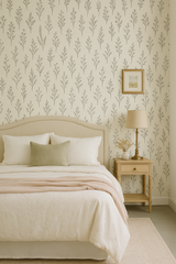 Botanical linework wallpaper with a subtle floral pattern, shown on a bedroom wall.
