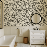 Haring Playhouse Wallpaper with a Keith Haring-inspired pattern of dancing figures and hearts.
